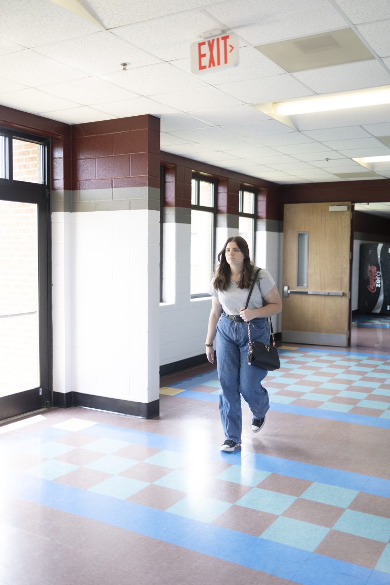 Student walking down the hallway.