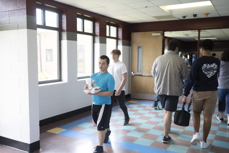 Students walking down the hallway.