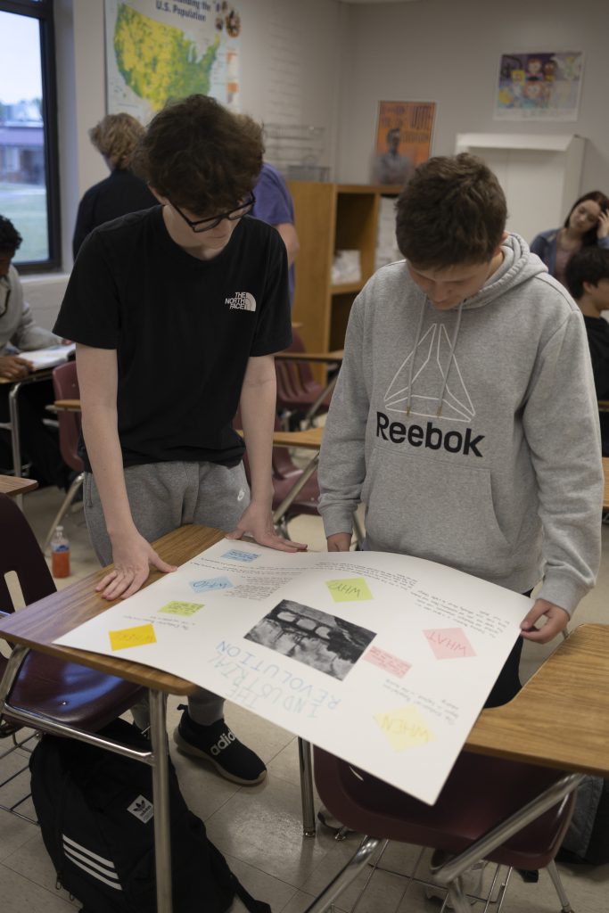 Two students reviewing a poster project.