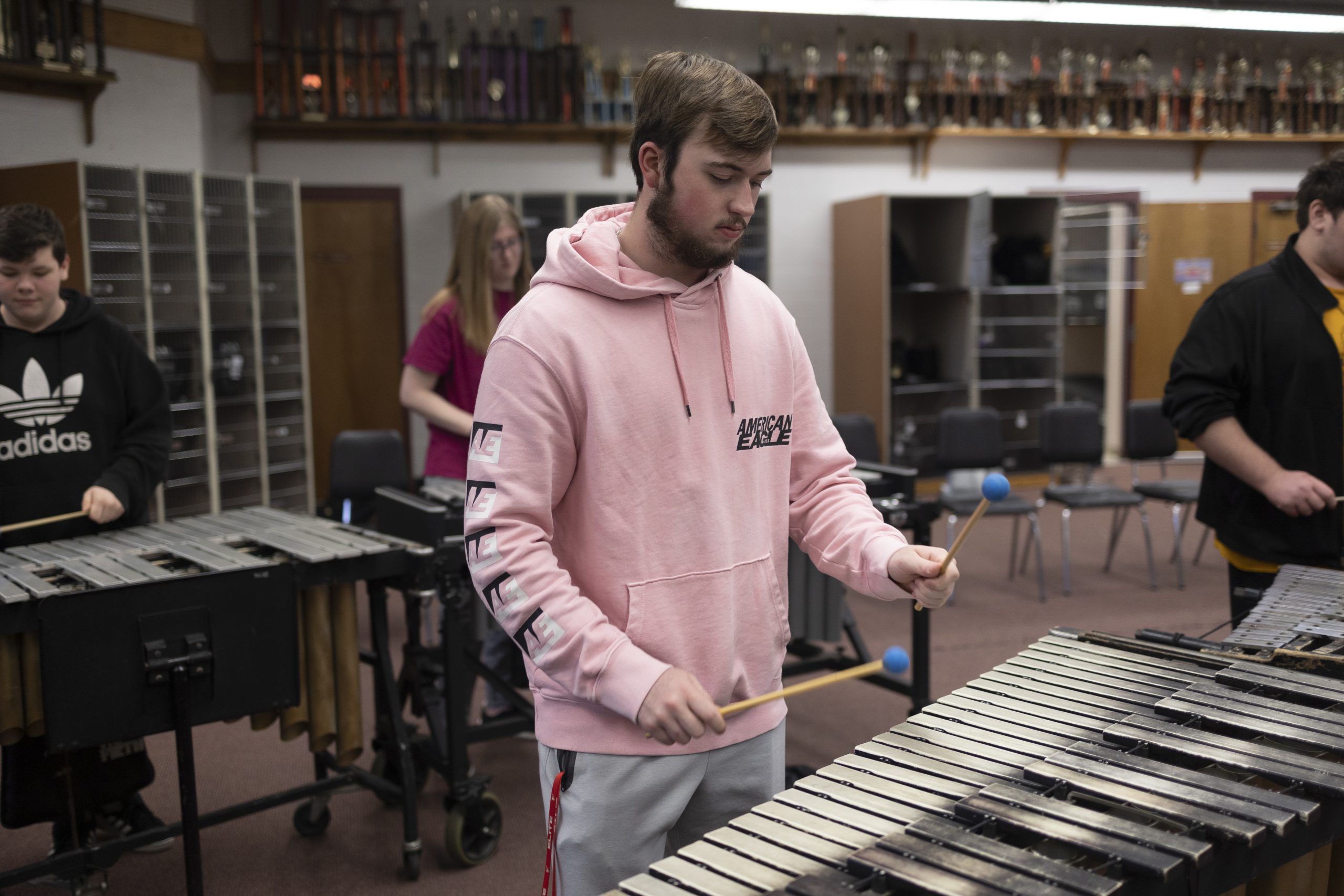 A student practices mallets in the band room.